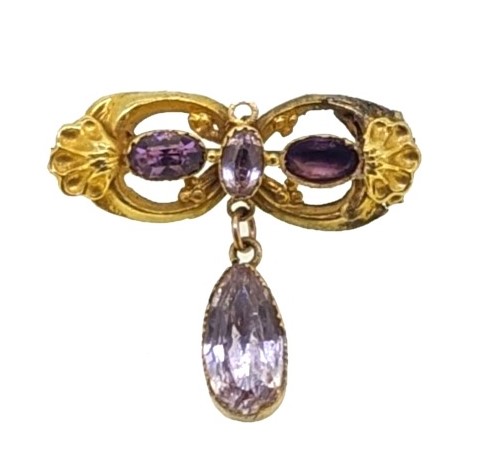 A 19th century foil backed topaz and amethyst memorial brooch which is going under the hammer in Cheffins online jewellery sale